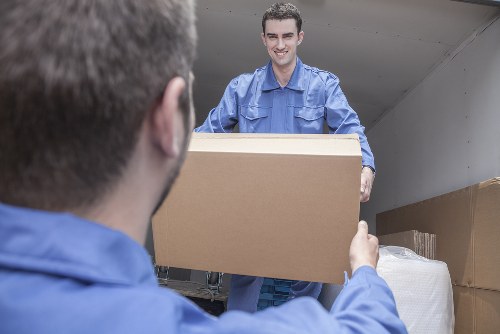 Removal team loading boxes for a transparent France removals quote