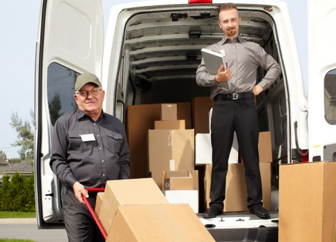 Van service for moving furniture in a French city street