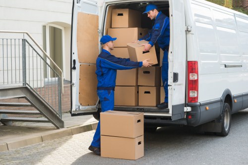 Loading household furniture into a moving truck in France