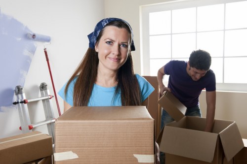 Local removals team handling furniture in a French apartment building