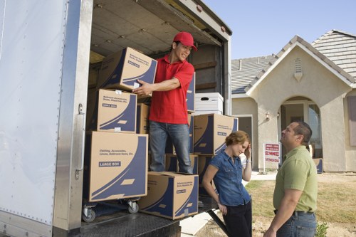 Removalists loading home items for a French relocation