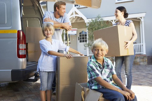 Professional movers handling household items during a local relocation in France