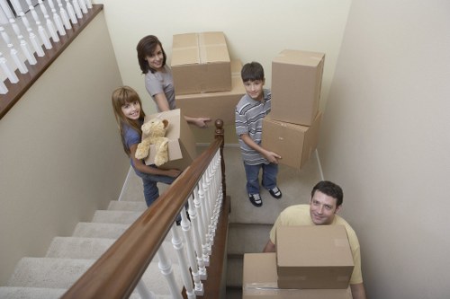 Office relocation team moving business equipment in France